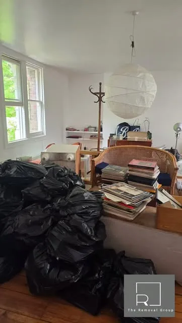 House clearance underway with items sorted and bagged for recycling