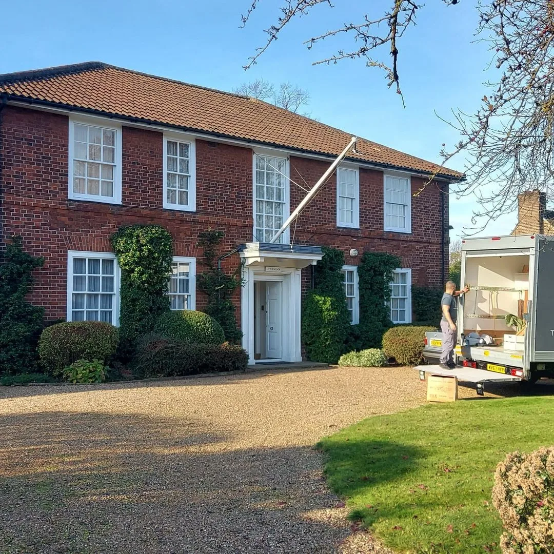 House move at a period red-brick home with the removal van on the drive