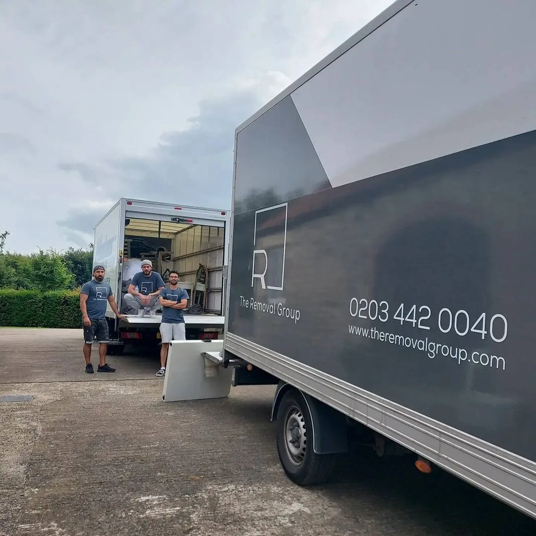 Removal Group crew loading two branded vans on a house move