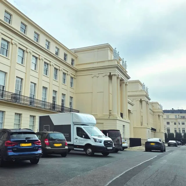 Two Removal Group vans on a move at a Regency terrace in London