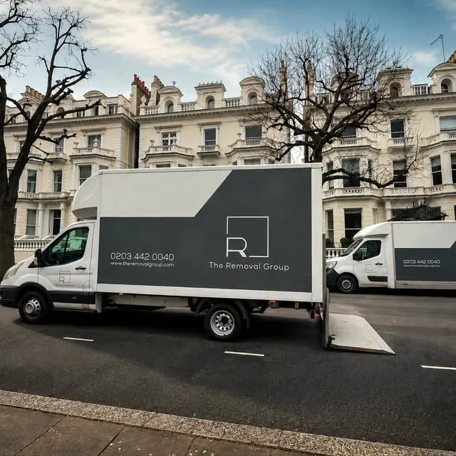 Two branded removal vans ready for a London move